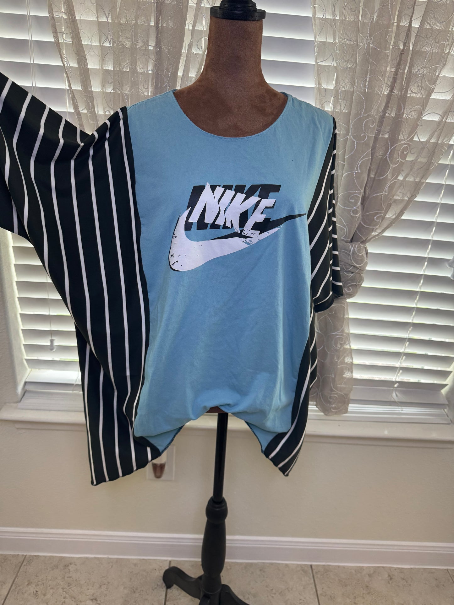 "NIKE" Light Blue T-Shirt with Black/White accents.  One Size Fits S-2X