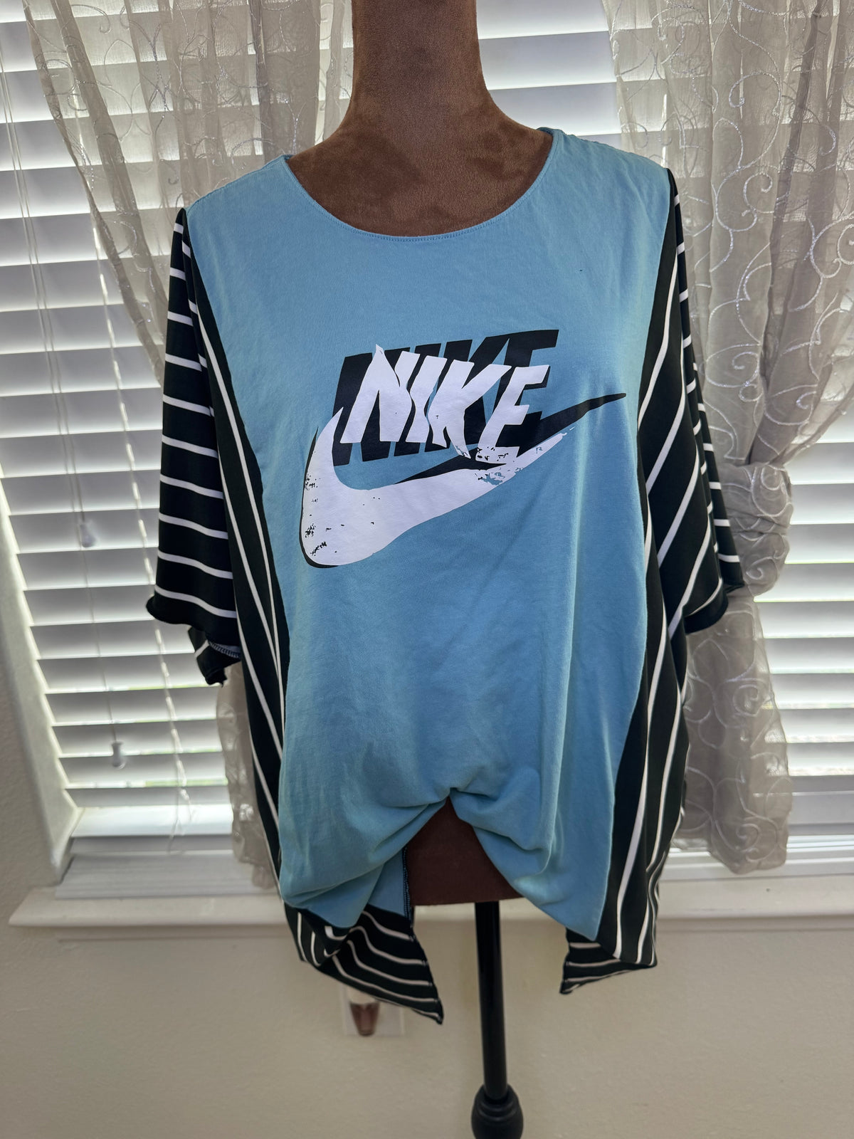 "NIKE" Light Blue T-Shirt with Black/White accents.  One Size Fits S-2X