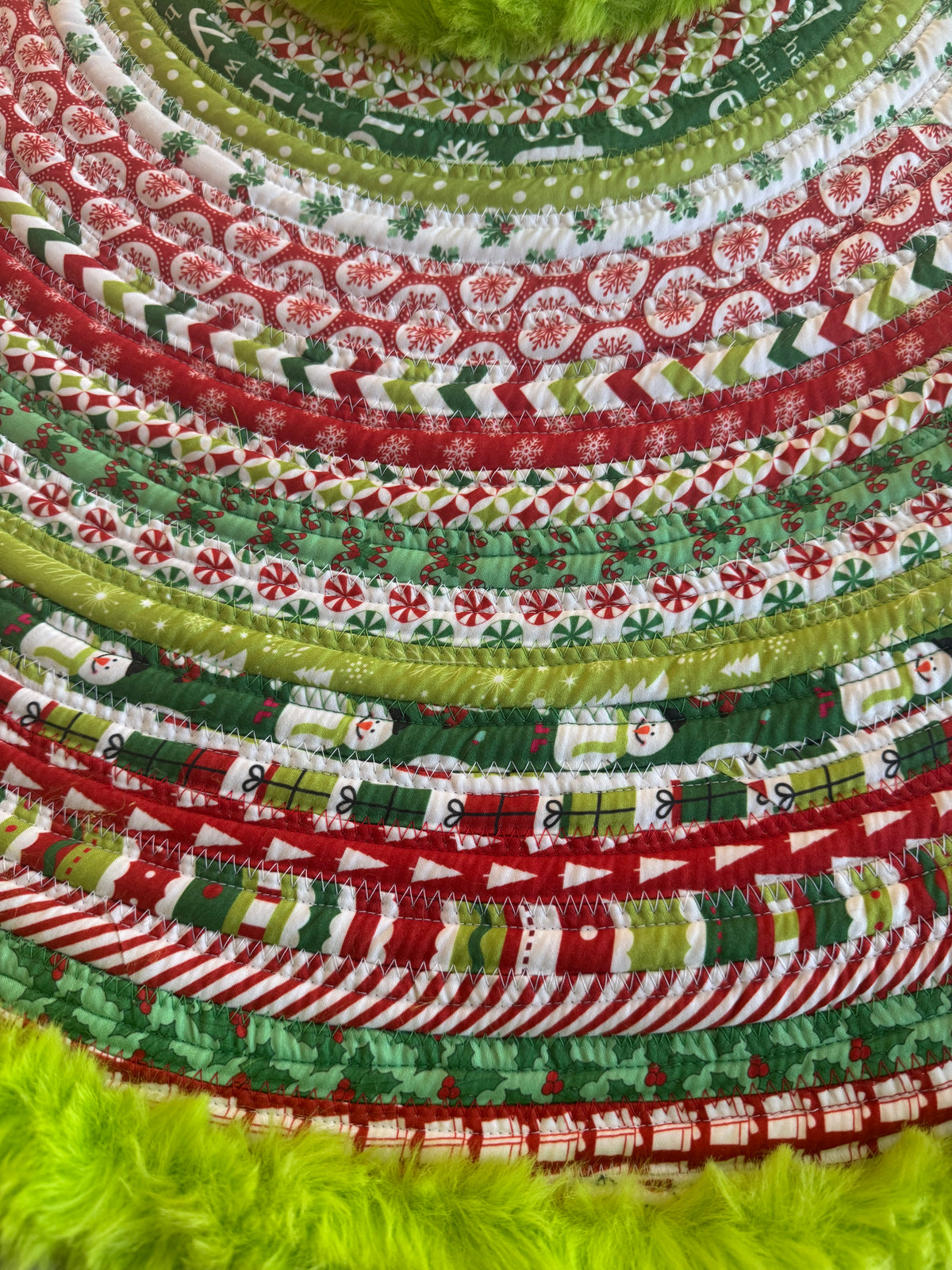 Grinch Jelly Roll Christmas Tree Skirt.