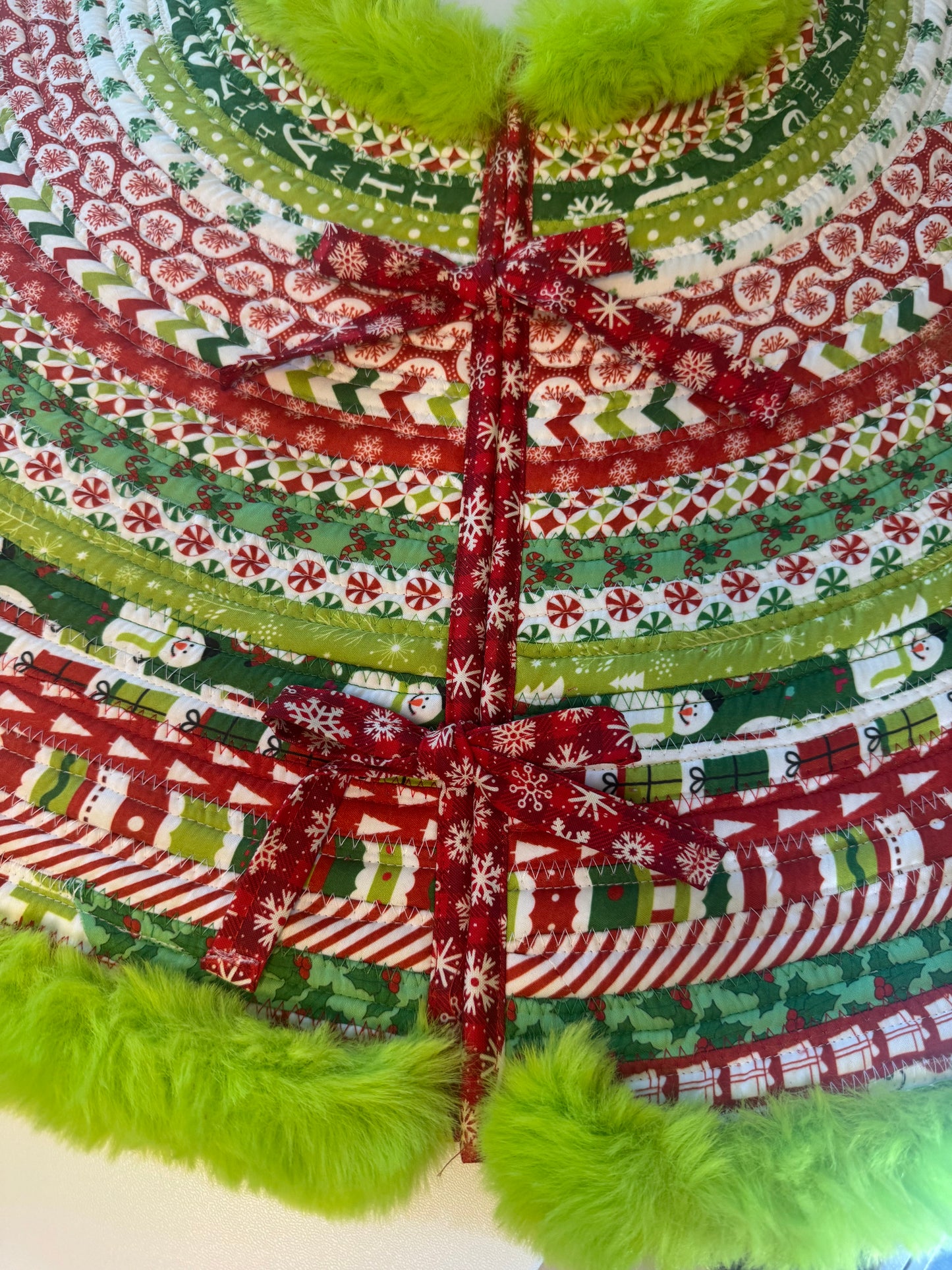 Grinch Jelly Roll Christmas Tree Skirt.