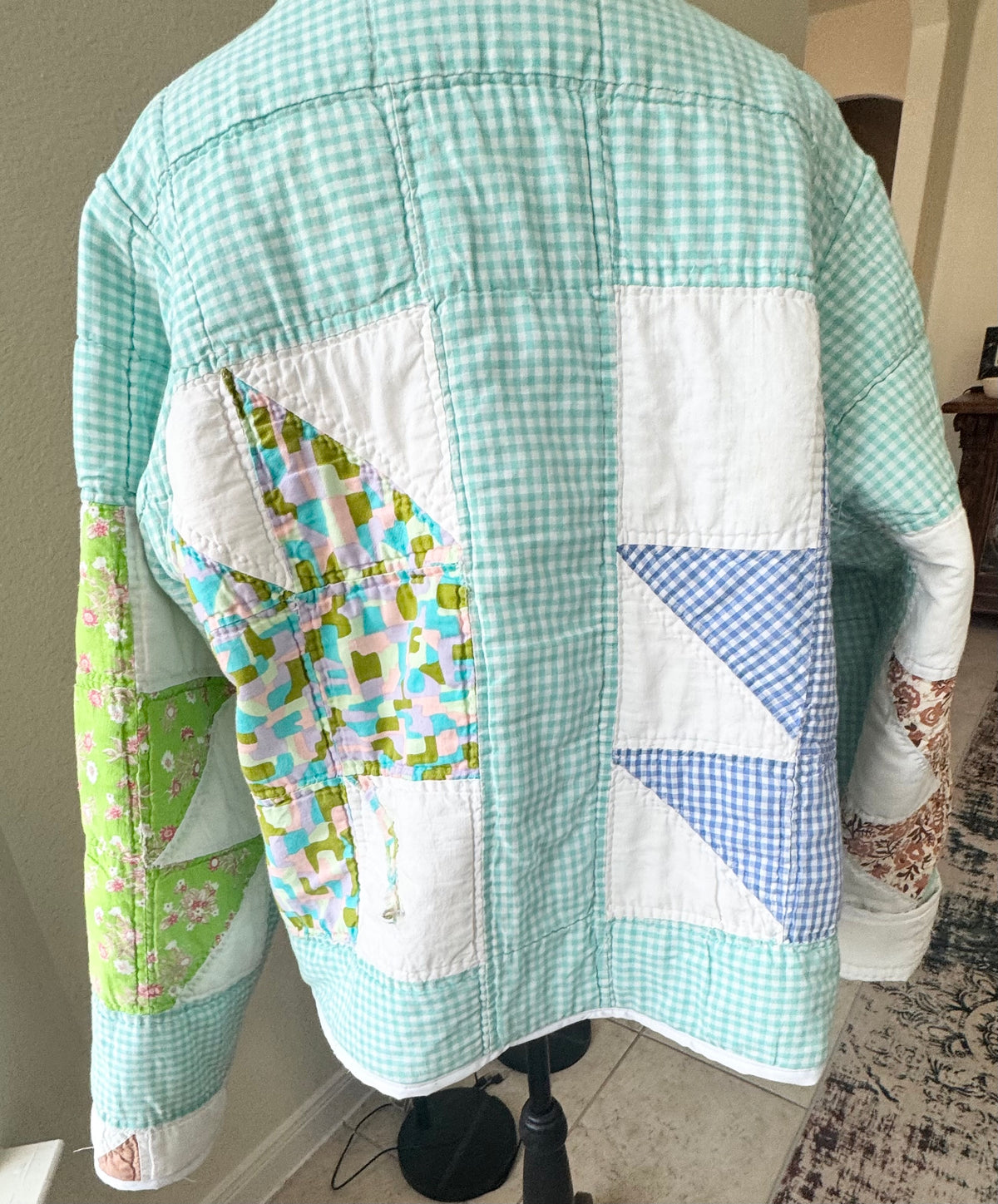 Checkered Leaf pattern quilted jacket.  Waist length. Size L