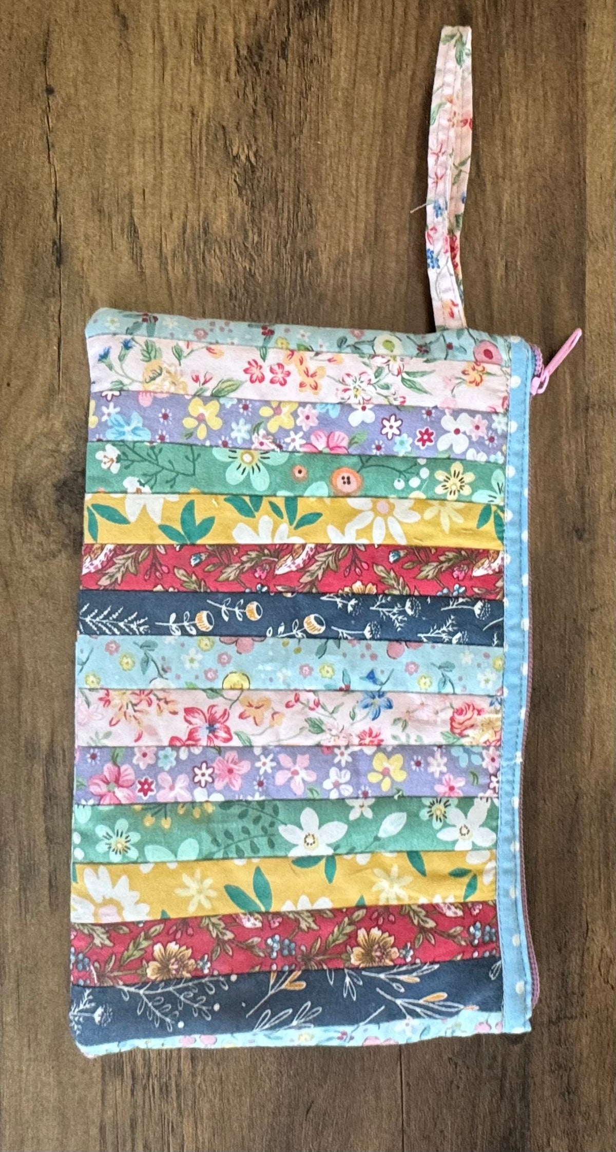 Multicolored Quilted Flower Wristlet.  10" w x 6" t