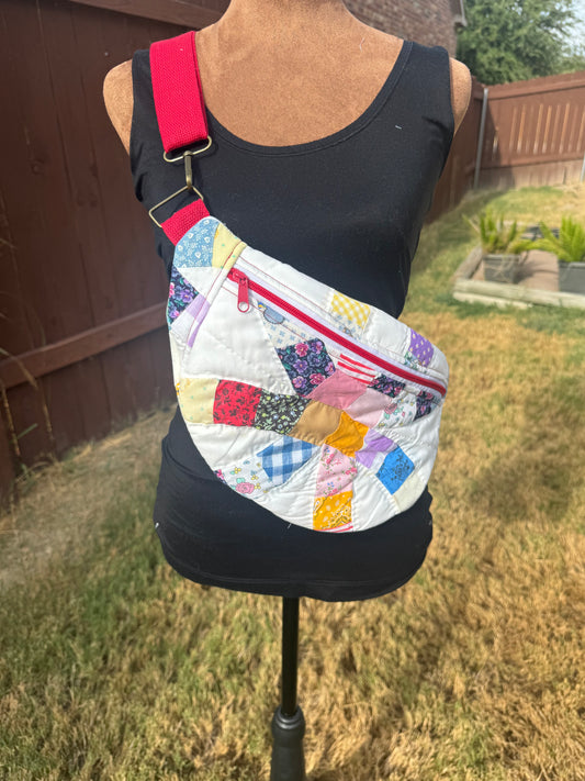 Double Wedding Circle Quilted Bumbag with red accents.
