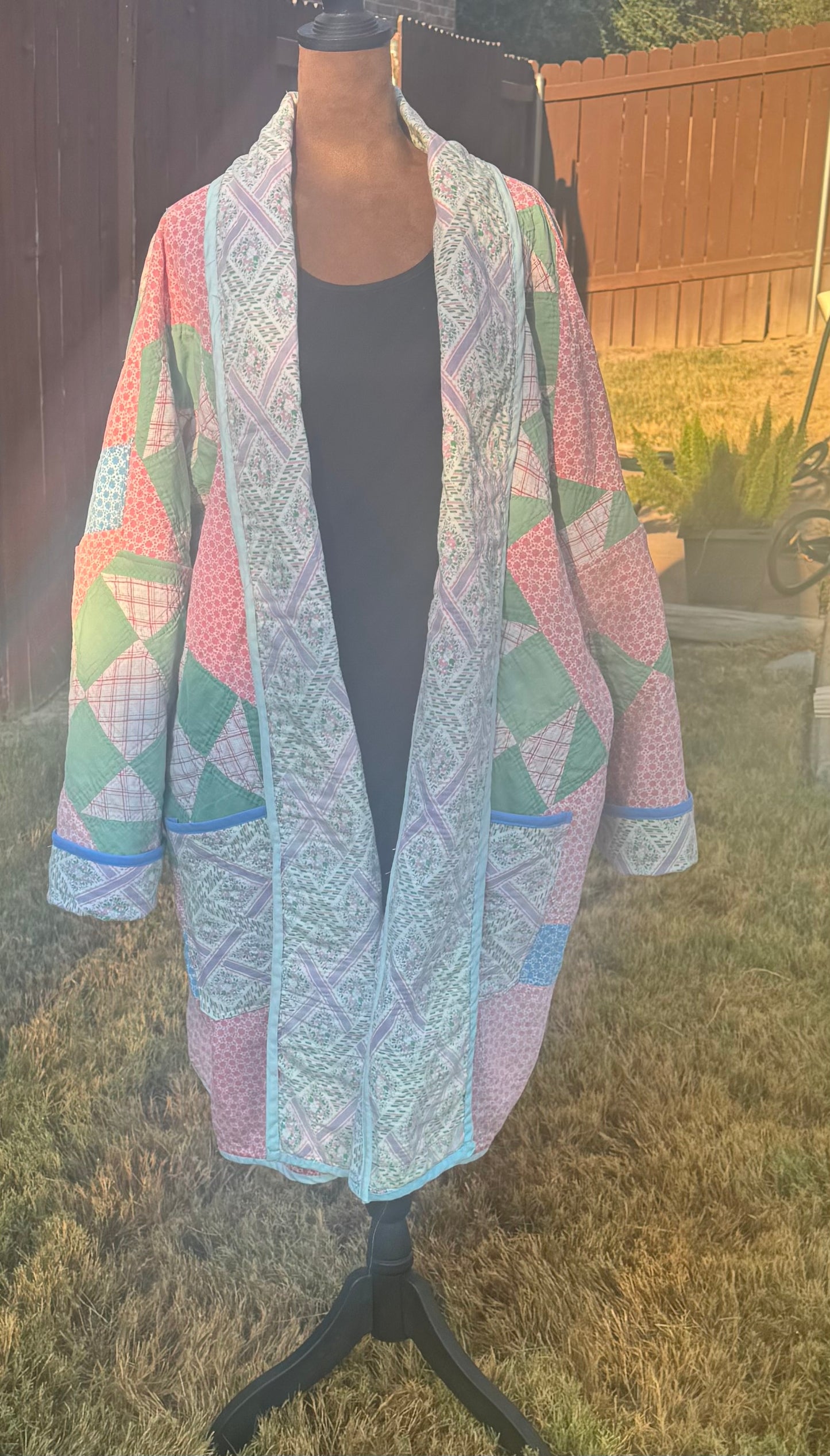 Vintage quilted 3/4 length jacket with beautiful pinks and greens.